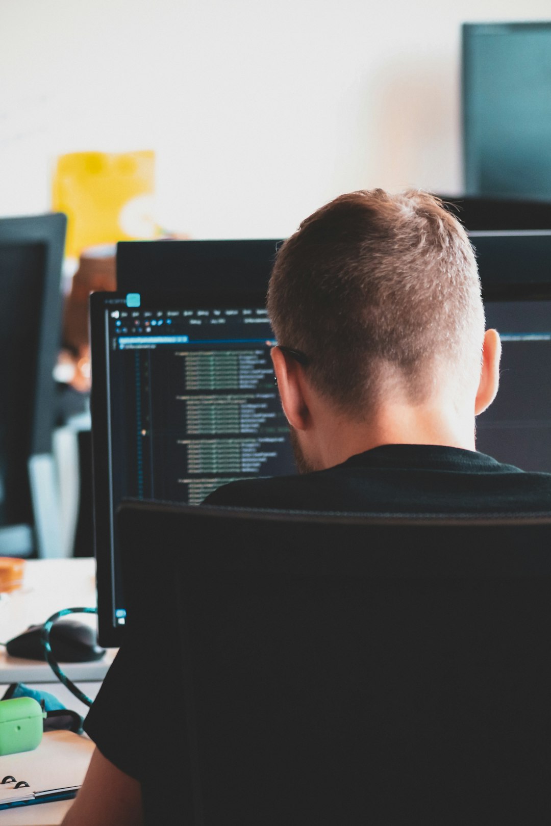 man-in-black-shirt-sitting-in-front-of-computer-lldyudtb7n4